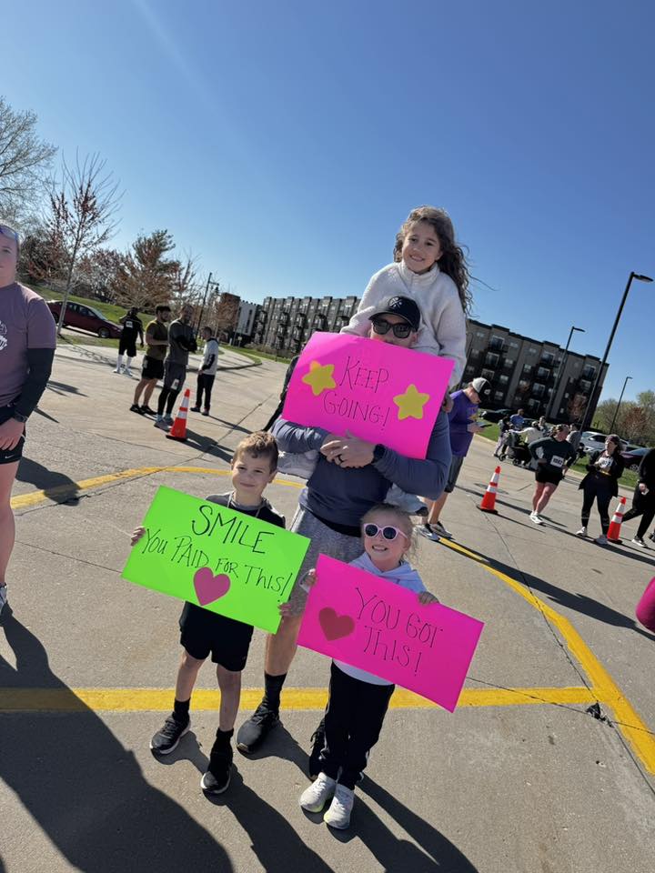 493484966_1227382779391955_5078666920260966317_n a group of people holding up signs that say keep going, you got this, and smile you paid for this.